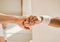 Fitness, hands and fist bump by men friends at indoor tennis court for support, motivation or training closeup. Zoom