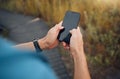 Fitness, hands and mockup phone screen of runner exercising in nature. Technology, digital tracking and man using