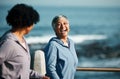 Fitness, happy and senior women by ocean for healthy body, wellness and cardio wellbeing on promenade. Sports, friends