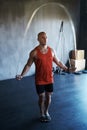 Fitness health, jump rope and man doing gym training, cardio endurance challenge or exercise performance. Skipping Royalty Free Stock Photo
