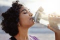 Fitness, health and sports woman drinking water to hydrate, relax and healthy energy outdoors in summer. Tired thirsty Royalty Free Stock Photo