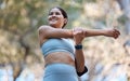 Fitness, healthcare and woman stretching arm getting ready for training, exercise or workout. Sports, wellness and happy Royalty Free Stock Photo