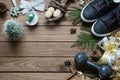 Fitness and Healthy Christmas sport composition. Flat lay of sport shoes, dumbbells, skipping rope and Christmas ornaments Royalty Free Stock Photo