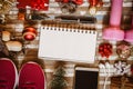 Fitness and Healthy Christmas sport composition. Overhead shot of sport shoes, dumbbells, skipping rope and Christmas ornaments Royalty Free Stock Photo