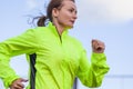 Fitness and Healthy Lifestyle Concepts. Female Athlete Having Running Exercise Outdoors
