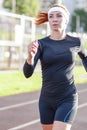 Fitness and Healthy Lifestyle Concepts. Female Athlete Having Running Exercise Outdoors