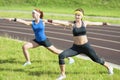 Fitness and Healthy Lifestyle Ideas and Concepts. Two Caucasian Girlfriends Having Arms Stretching Exercises Royalty Free Stock Photo