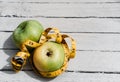 Fitness and healthy lifestyle. Vitamins and minerals, delicious and healthy food. Two yellow and green apples are lying on a white Royalty Free Stock Photo