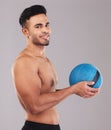 Fitness, Hispanic man and medicine ball on studio portrait with smile on face and gray background. Exercise, gym and Royalty Free Stock Photo
