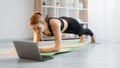 fitness at home pilates online woman plank laptop