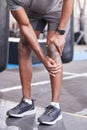 Fitness, injury and knee pain of black man at gym with inflammation problem resting legs. Joint pain, accident and