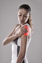 Fitness, injury and shoulder pain, woman and red glow for muscle or tendon tension on white background. Exercise