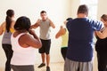 Fitness Instructor In Exercise Class For Overweight People Royalty Free Stock Photo