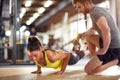 Fitness instructor with girl on training Royalty Free Stock Photo