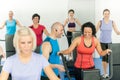 Fitness instructor leading class of alpinning Royalty Free Stock Photo