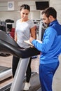 Fitness instructor writing program to his client