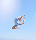 Fitness, jumping and sky with a sports woman mid air outdoor against a clear blue background during summer. Workout Royalty Free Stock Photo
