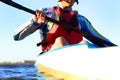 Fitness, kayak and a man rowing in the water of a river alone outdoor in nature during summer adventure. Sports Royalty Free Stock Photo