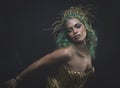 Fitness Latin woman with green hair and gold costume with handmade flourishes, fantasy image and tale