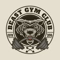 Fitness logo with wolf head biting barbell