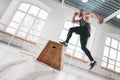 Strong man doing a box jump exercise at light hall Royalty Free Stock Photo