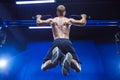 Fitness man doing pull-ups in a gym for a back workout back view Royalty Free Stock Photo