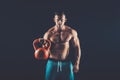 Fitness man doing a weight training by lifting heavy kettlebell Royalty Free Stock Photo