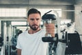 Fitness Man is Exercising Dumbbell Lifting in Gym., Portrait of Caucasian Handsome man Doing Weightlifting and Workout for Healthy Royalty Free Stock Photo