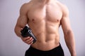 Fitness Man Holding Protein Shaker Bottle