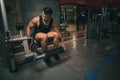 Fitness man with leg training machine in gym Royalty Free Stock Photo