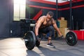 Fitness man lifting weights in gym fitness, Muscular man working out in gym doing exercises with barbell weight