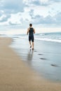 Fitness Man Running On Beach. Runner Jogging During Outdoor Workout Royalty Free Stock Photo