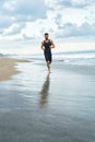 Fitness Man Running On Beach. Runner Jogging During Outdoor Workout Royalty Free Stock Photo