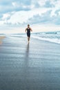 Fitness Man Running On Beach. Runner Jogging During Outdoor Workout Royalty Free Stock Photo