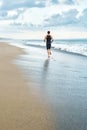 Fitness Man Running On Beach. Runner Jogging During Outdoor Workout Royalty Free Stock Photo