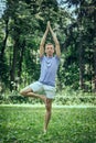 Fitness, man training yoga in tree pose in park Royalty Free Stock Photo