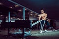 Fitness man working out with battle ropes at gym Royalty Free Stock Photo