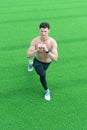 Fitness man working out outdoor. man training body. man with muscular body. sporty person doing stretching outside