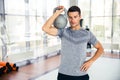 Fitness man workout with kettle ball in gym Royalty Free Stock Photo