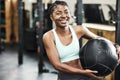 Fitness, medicine ball and portrait of black woman in gym for strength training or workout. Equipment, exercise and Royalty Free Stock Photo