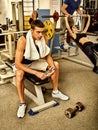 Fitness men friends in gym workout weights with equipment. Royalty Free Stock Photo