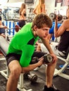 Fitness men friends in gym workout weights with equipment. Royalty Free Stock Photo