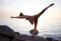 Young mixed race sporty woman do exercises on the beach in morning Royalty Free Stock Photo