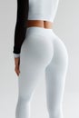 Fitness model in leggings with beautiful buttocks. Sporty booty Royalty Free Stock Photo