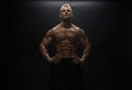 Fitness model man posing in studio