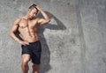 Fitness model portrait, muscular build man relaxing.