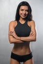 Fitness model posing in studio on a white grey background Royalty Free Stock Photo