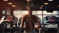 Fitness Momentum: Energetic Young Woman Jogging on Gym Treadmill