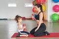 Fitness mother and child. Sports activities with children. Fitness center. Mom and baby gymnastics, yoga exercises. Health and Royalty Free Stock Photo