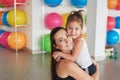 Fitness mother and child. Sports activities with children. Fitness center. Mom and baby gymnastics, yoga exercises. Health and Royalty Free Stock Photo